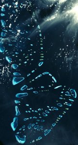 Satellite view of North and South Malosmadulu Atolls in the Maldives, northern Indian Ocean, southwest of India, made up of a chain of 1,192 small coral islands by National Aeronautics and Space Administration National Aeronautics and Space Administration